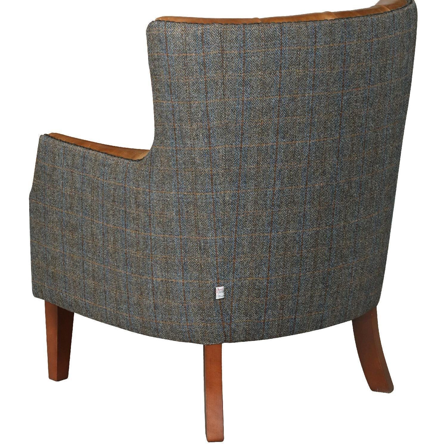 Grey plaid upholstered armchair with wooden legs, rear view