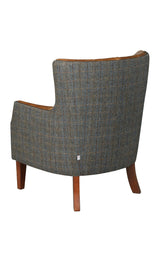 Grey plaid upholstered armchair with wooden legs, rear view