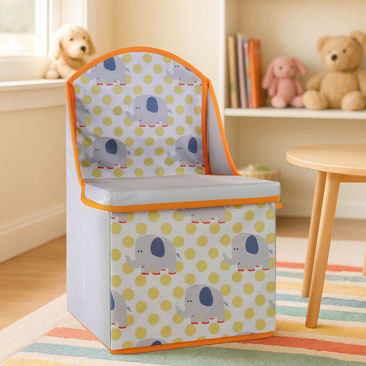 Colorful children's storage seat featuring an elephant design with a blue and yellow polka dot pattern. The seat has a soft, padded backrest and a hinged lid for storage, set against a light-colored room with a plush rug and teddy bears in the background