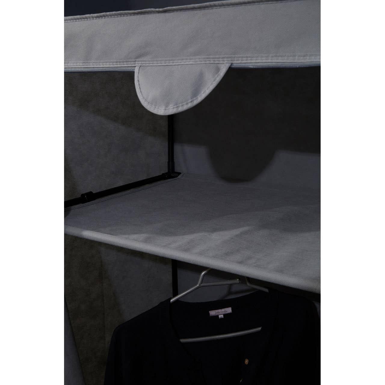 Fabric wardrobe shelf with hanging rail and black shirt on hanger
