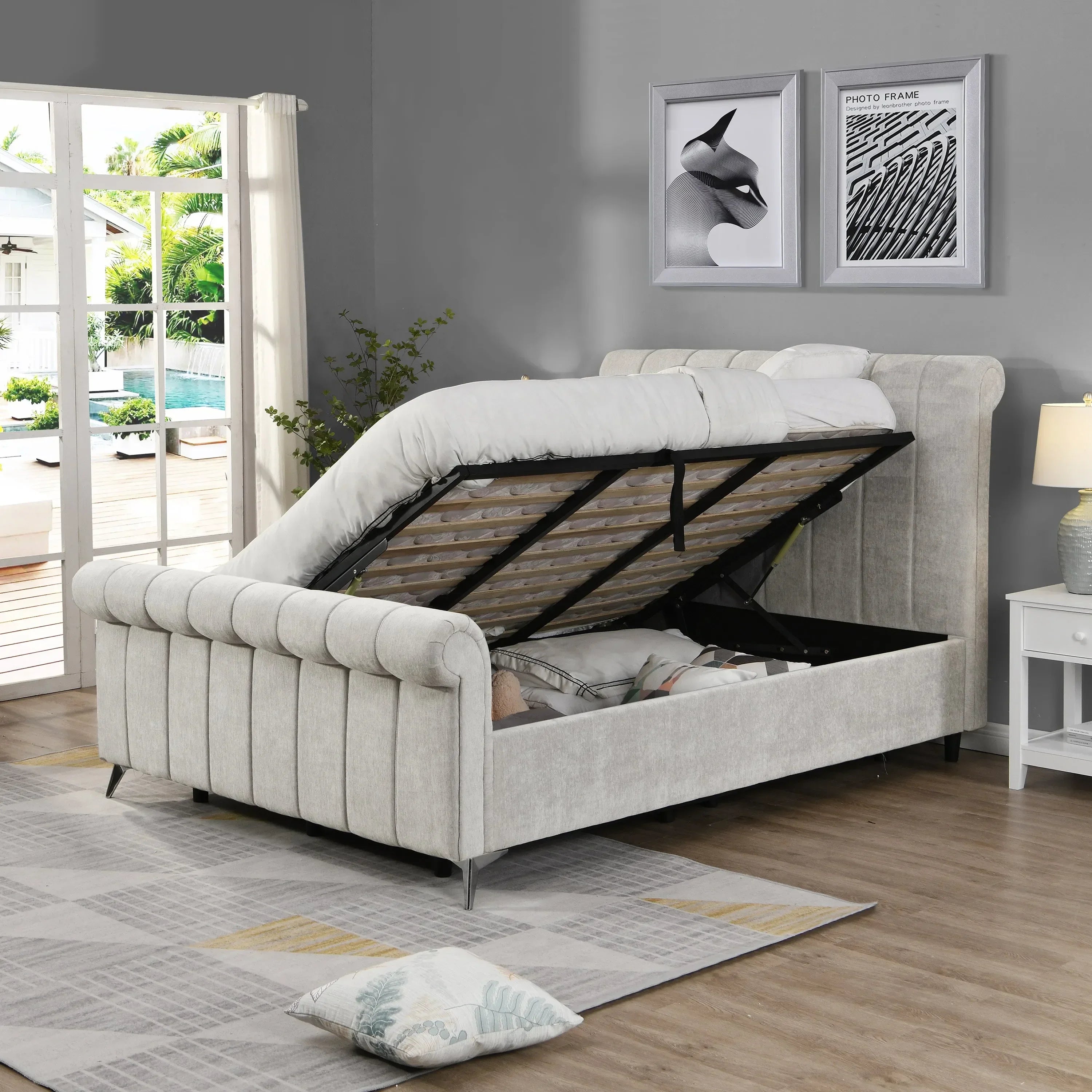 Light grey ottoman storage bed with open lift-up base in modern bedroom setting