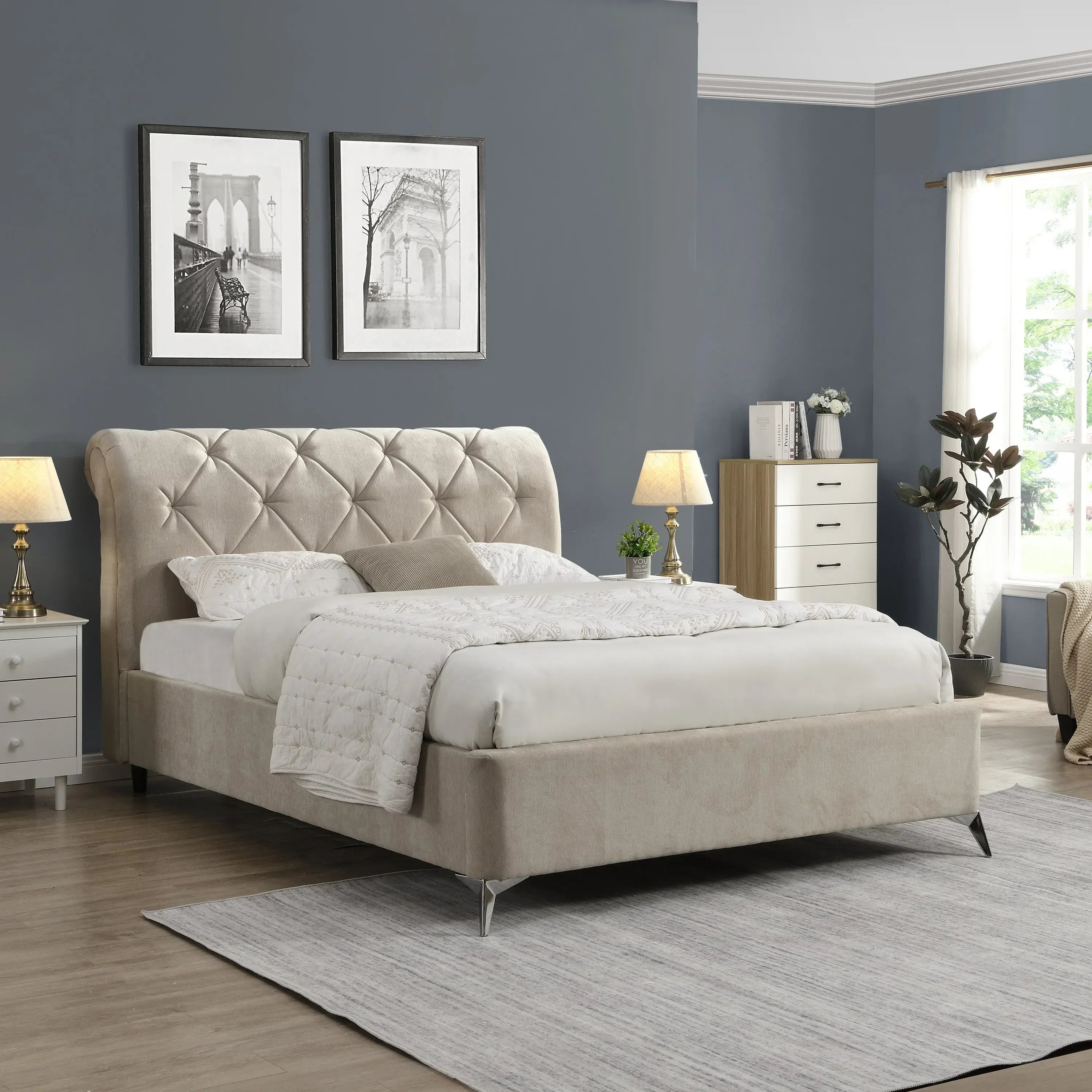Beige upholstered bed with button-tufted headboard in modern bedroom with grey walls