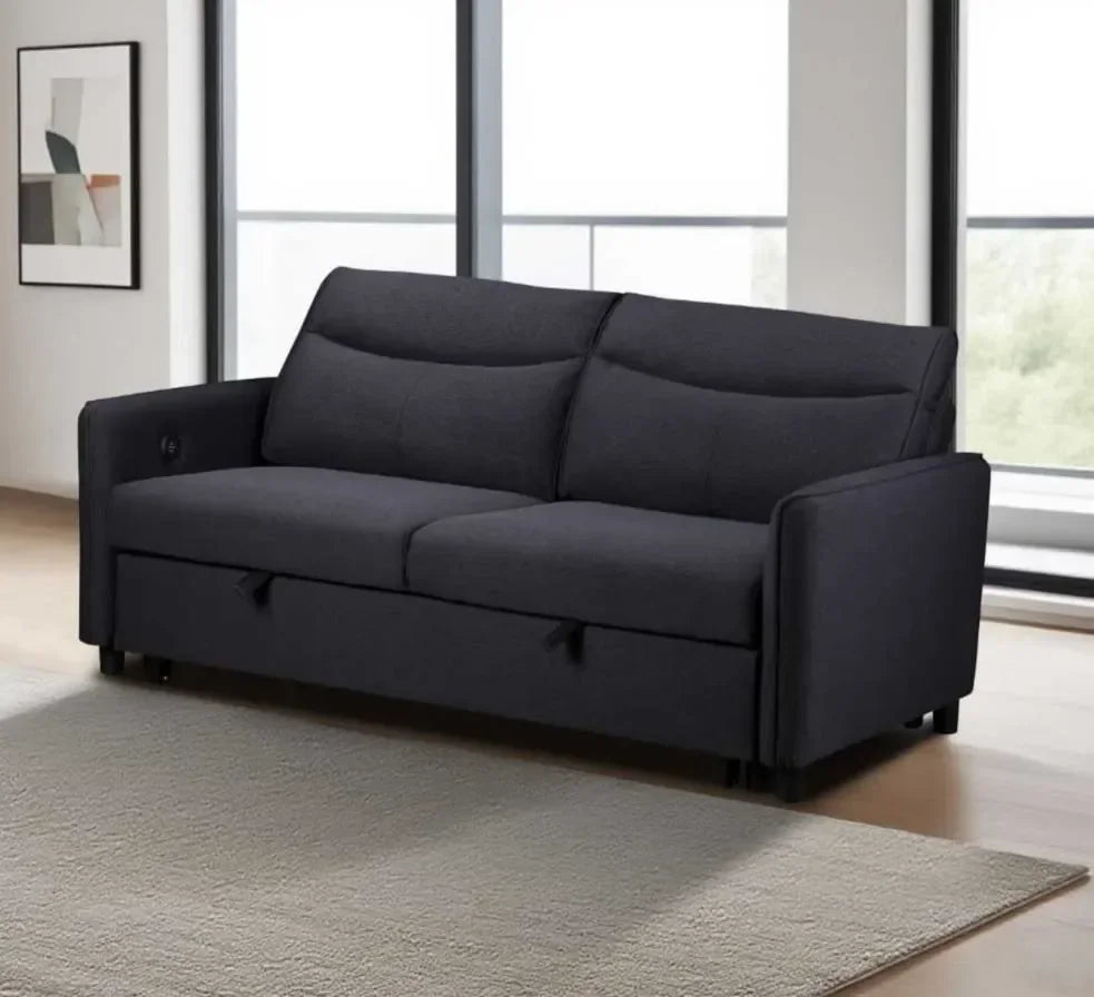 Dark grey fabric sofa with wide arms in modern living room by large windows