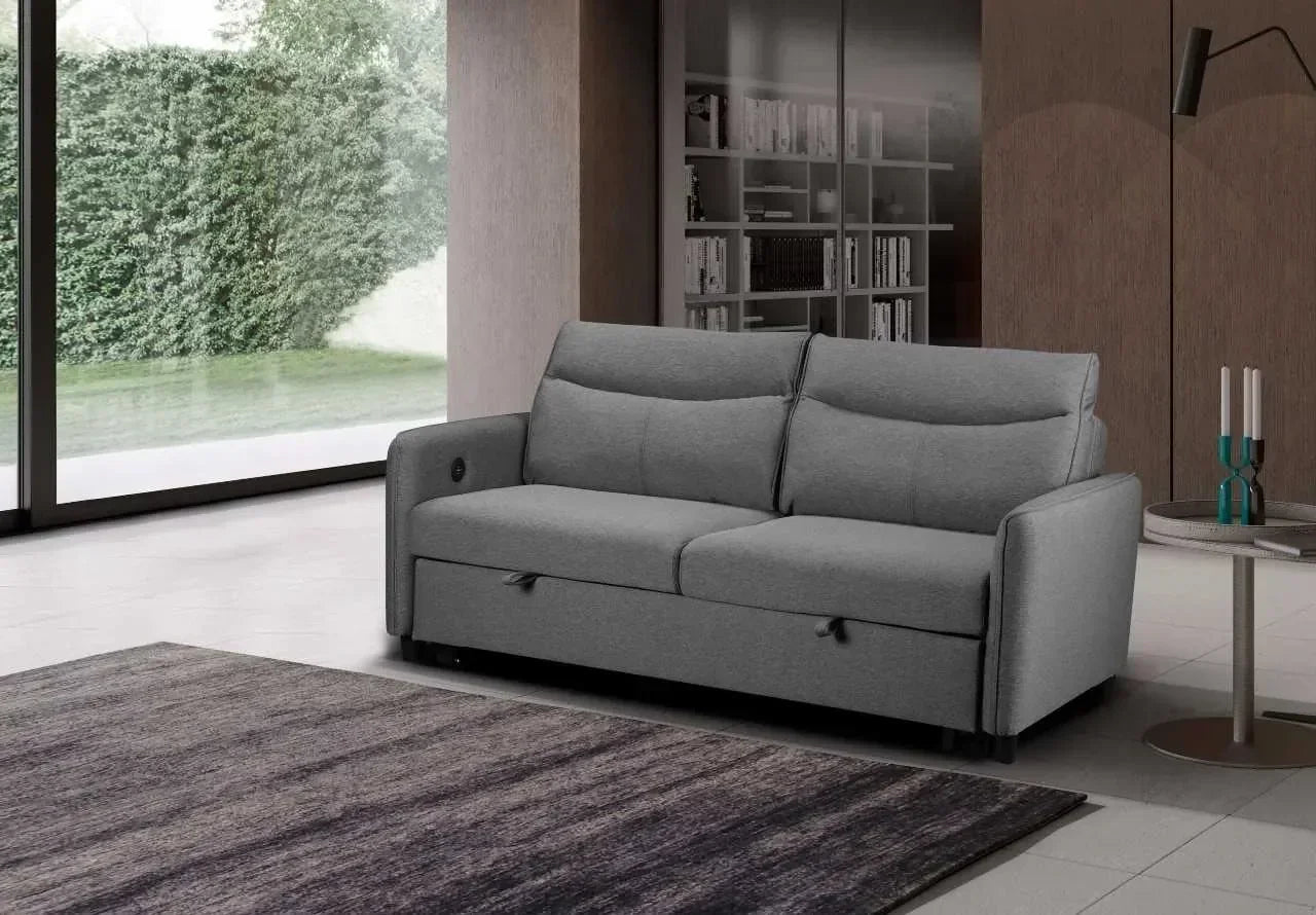 Grey fabric two-seater sofa with cushions in a modern living room setting