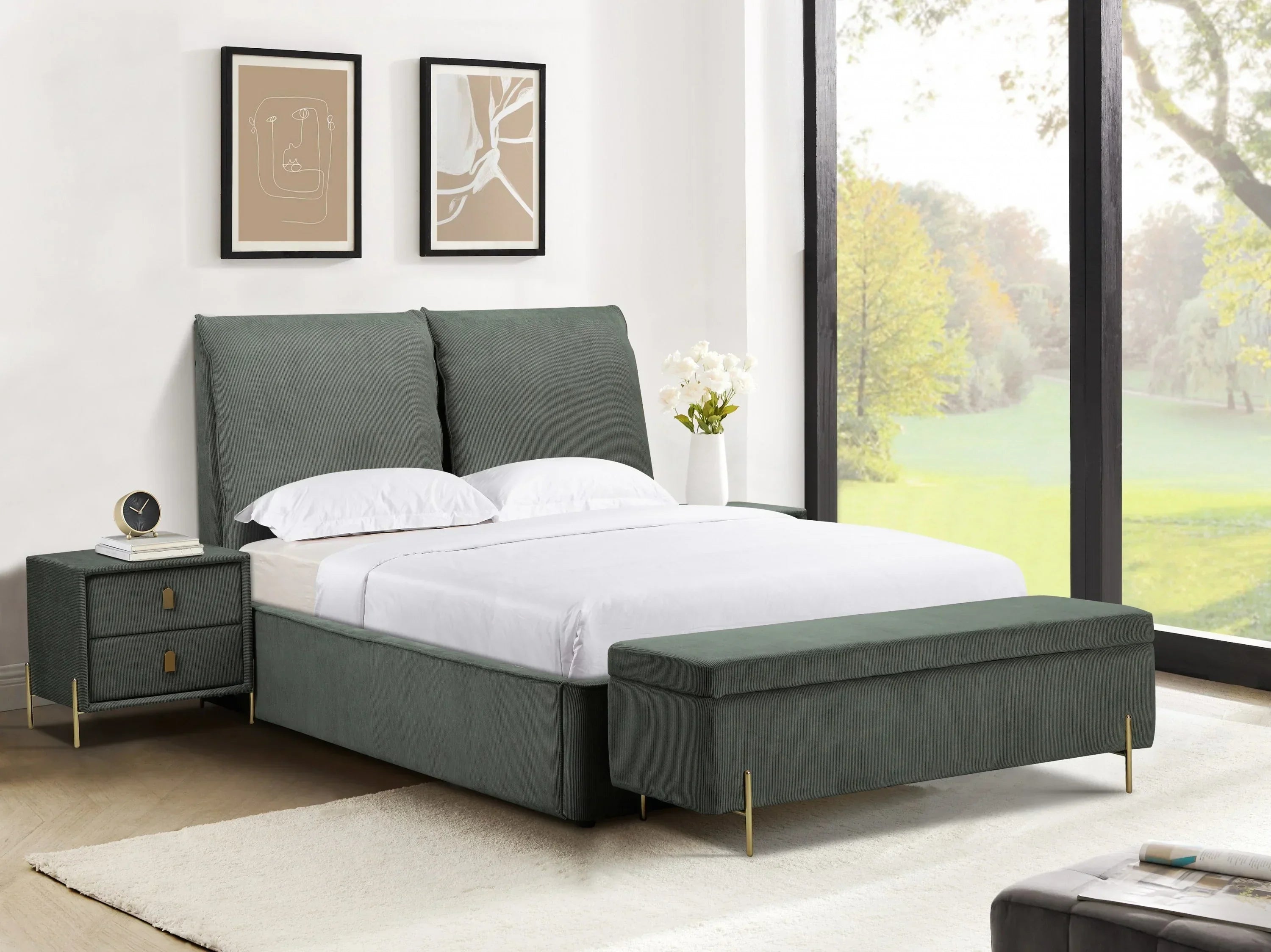 Green upholstered bed with white bedding, matching bench and bedside table in modern bedroom