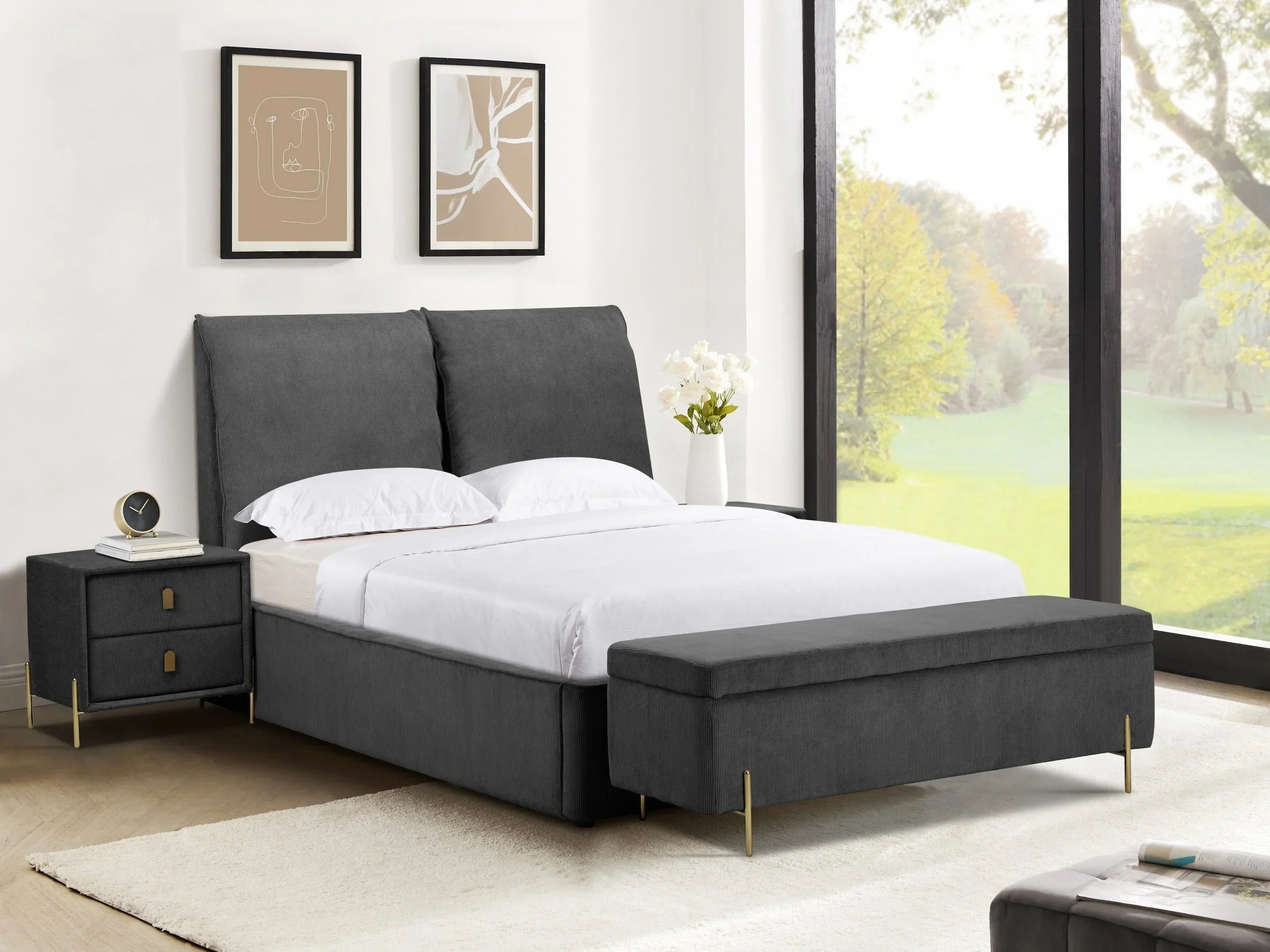 Charcoal upholstered bed with matching bench and nightstand in modern bright bedroom