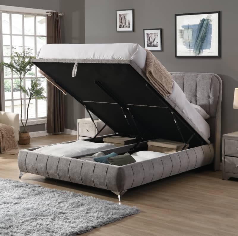 Grey upholstered ottoman bed frame with open lift-up storage in modern bedroom