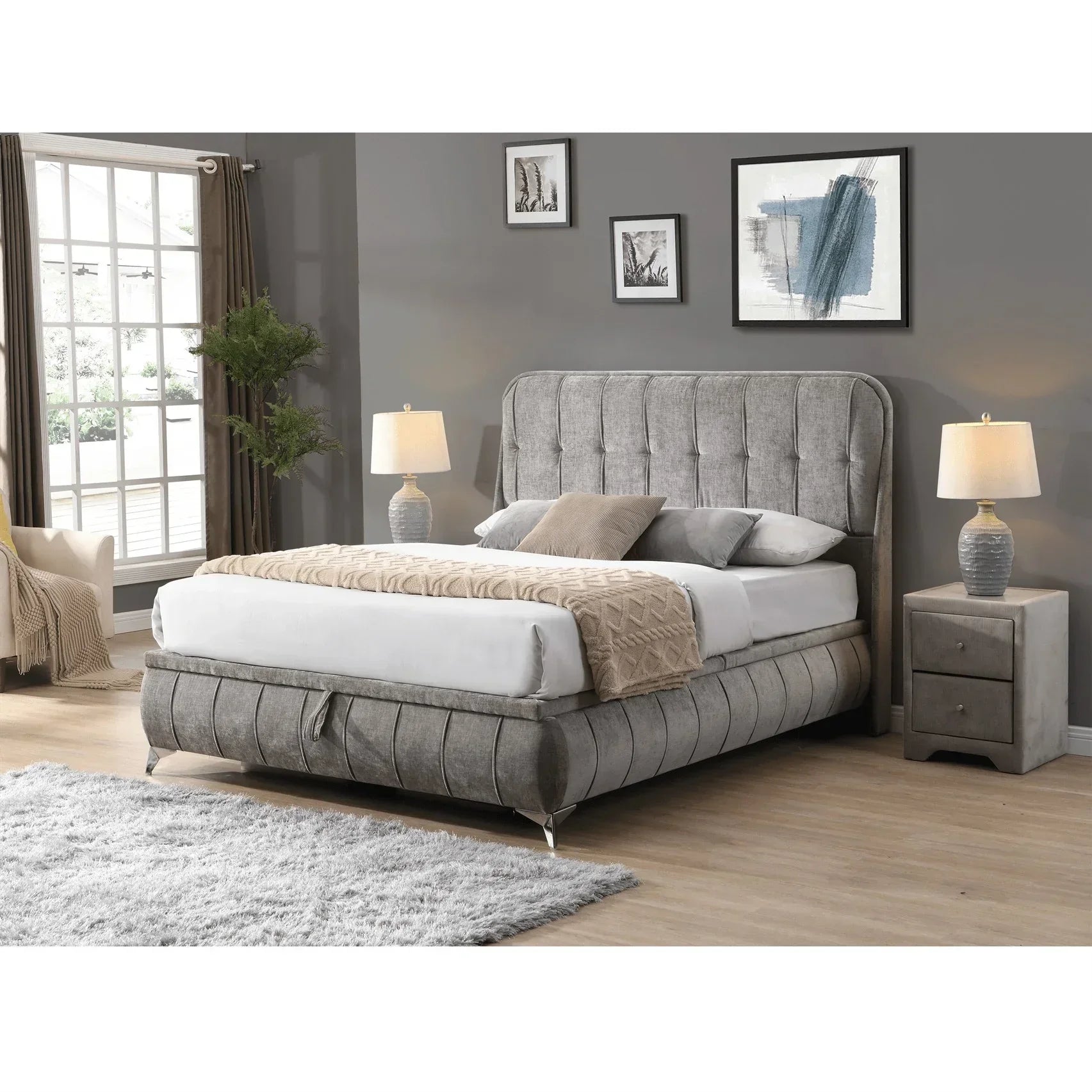 Grey upholstered bed frame with tufted headboard, bedside tables and lamps in modern bedroom