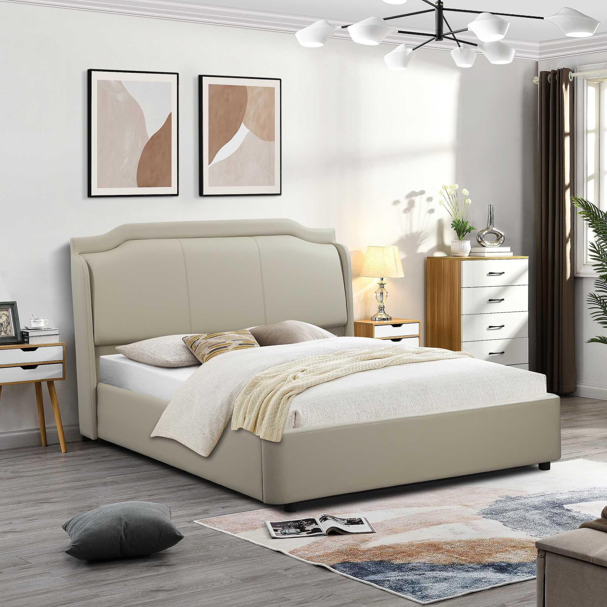 Beige upholstered bed with high headboard in modern bedroom with wooden drawers and soft rug