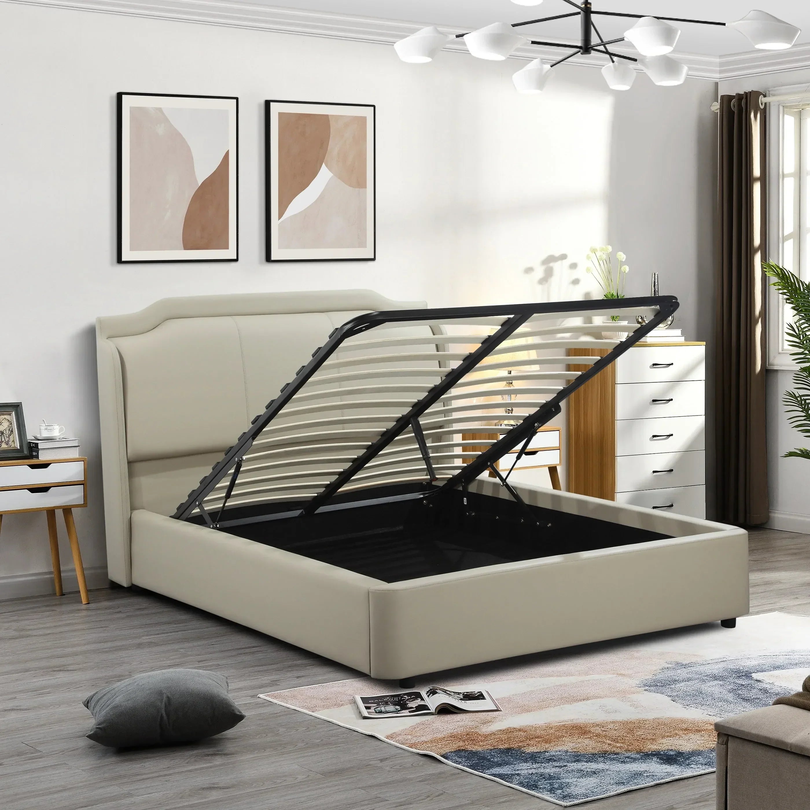 Beige upholstered ottoman storage bed with open lift base in modern bedroom