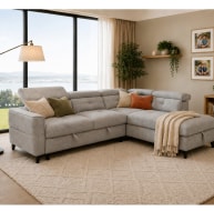 Grey corner sofa with plush cushions and a cozy throw, set in a bright living room with large windows