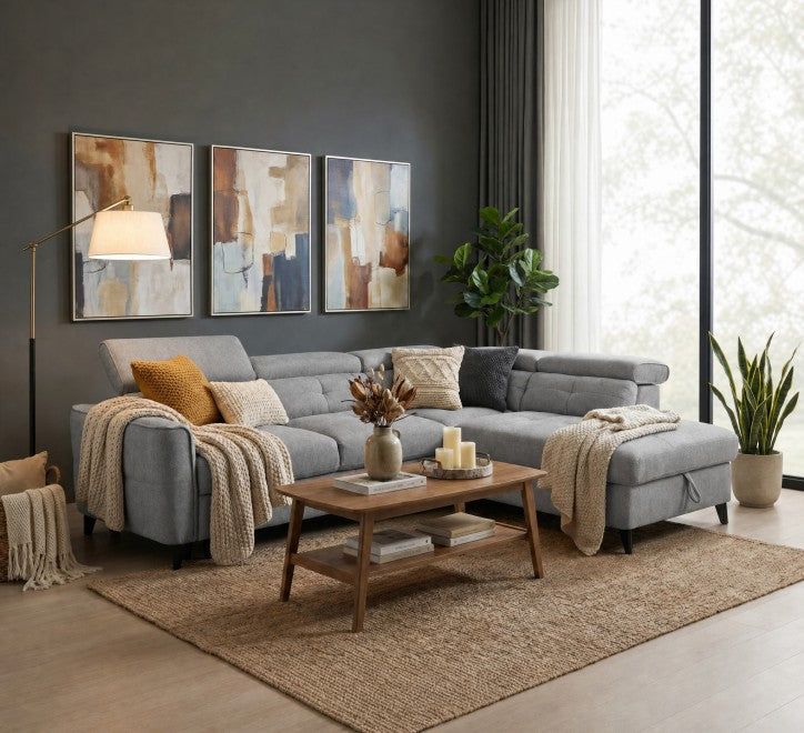Grey corner sofa with cozy throw pillows and blankets in a stylish living room setting