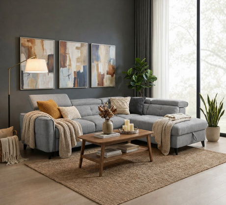 Grey corner sofa with cozy throw pillows and blankets in a stylish living room setting
