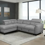 Grey corner sofa with tufted design and modern style in a bright living room setting