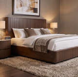 Elegant Cleo Bed with a wooden headboard, soft bedding, and stylish nightstands in a cozy setting