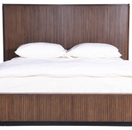 Cleo Bed with a stylish ribbed headboard and soft white bedding for a modern bedroom aesthetic