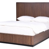 Modern wooden bed with a sleek headboard and white bedding for a stylish bedroom look