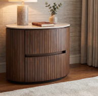Cleo Locker with a curved design, wooden slats, and a marble top in a cozy interior setting
