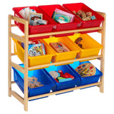 Three-tier storage unit made of pine wood featuring colorful bins in red, yellow, and blue. The top tier has two red bins filled with toys, the middle tier has two yellow bins with books and games, and the bottom tier has two blue bins containing various play items. The frame is sturdy and designed for children's use