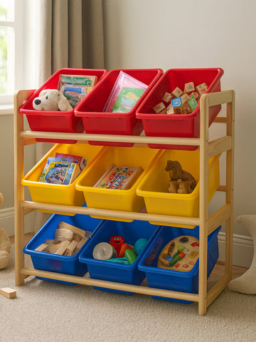 Three-tier storage unit made of pine wood featuring colorful plastic bins in red, yellow, and blue. The top tier has two red bins, the middle tier has two yellow bins, and the bottom tier has three blue bins. The unit is positioned against a wall with natural light coming through a window, and it is filled with various toys and books