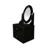 Black vanity table featuring an oval glass mirror and two storage drawers underneath. The design is sleek and modern, with a glossy finish that enhances its elegant appearance