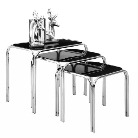 Set of three black glass nesting tables with chrome frames and decorative silver deer bookends