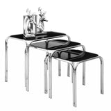 Set of three black glass nesting tables with chrome frames and decorative silver deer bookends