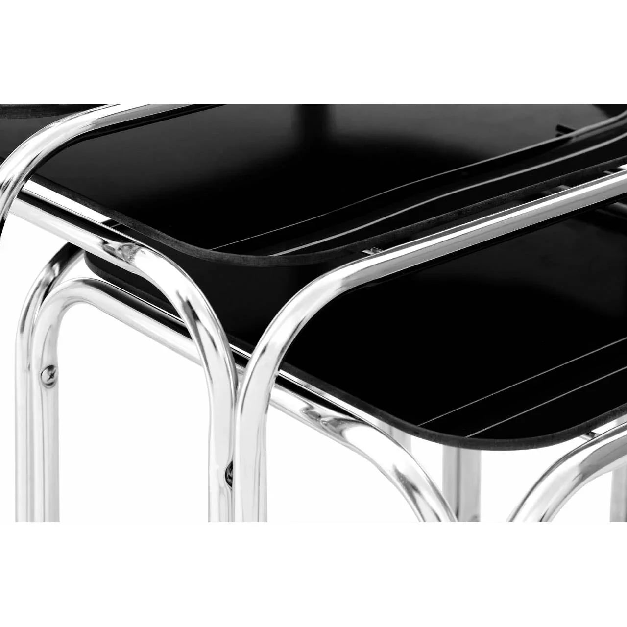 Black nesting tables with chrome metal frame close-up