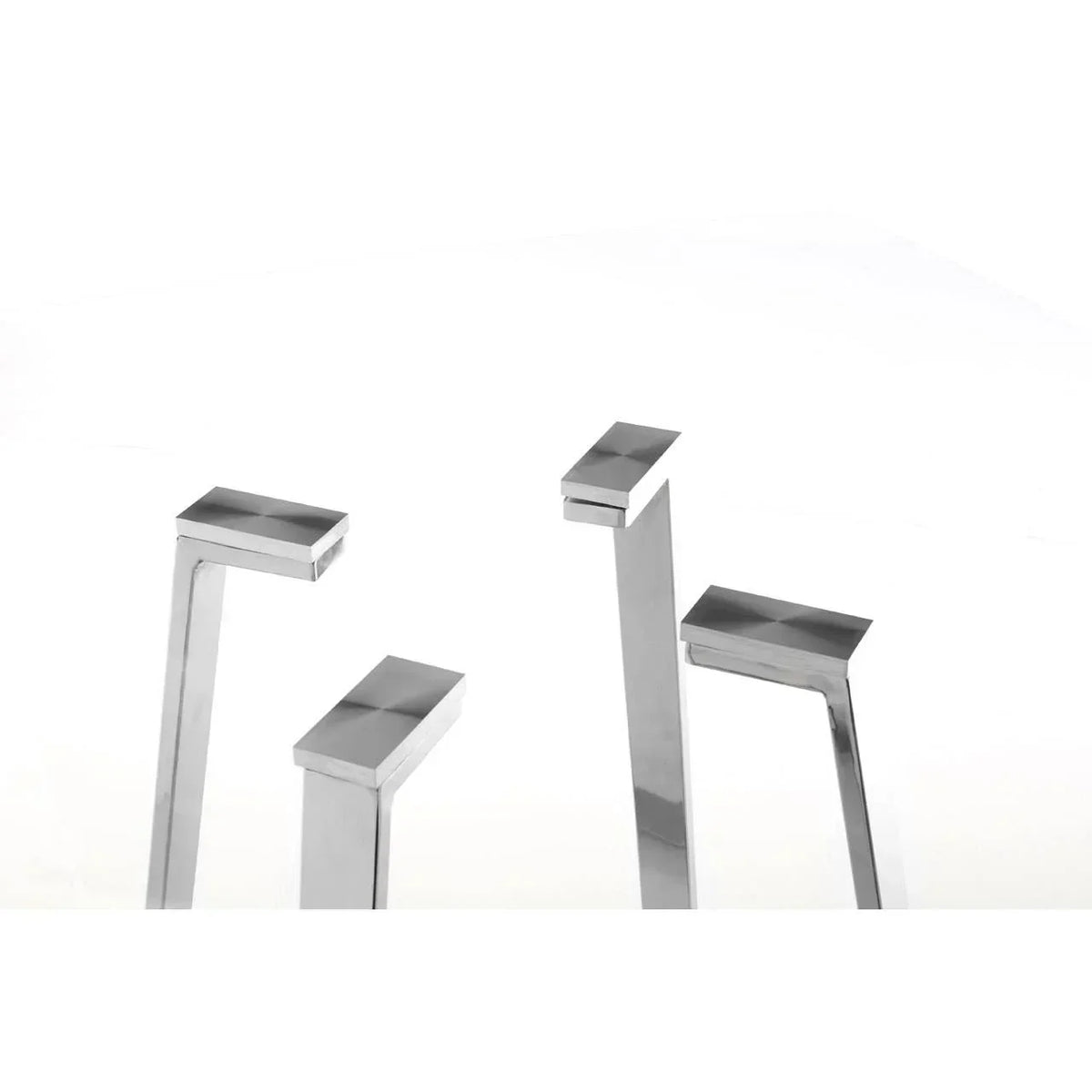 Close-up of four chrome metal table legs with angled design on white background