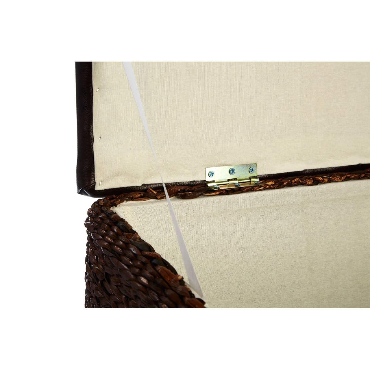 Closeup of woven storage ottoman with open lid, showing beige fabric lining and metal hinge