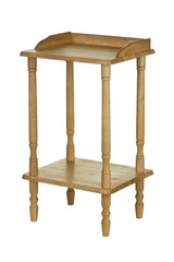 A side table made of tropical Hevea wood featuring a smooth top surface and a lower shelf, supported by four elegantly turned legs. The wood has a light, natural finish that highlights its grain