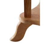 Close-up view of the curved leg of a round side table made from tropical Hevea wood, showcasing its smooth finish and natural wood grain. The leg features a unique, flowing design that adds an elegant touch to the overall structure
