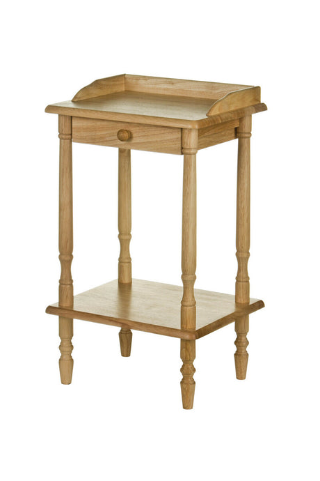 Rectangular side table made from tropical Hevea wood, featuring a raised edge on the top surface, a single drawer, and a lower shelf, supported by four turned legs. The wood has a light, natural finish