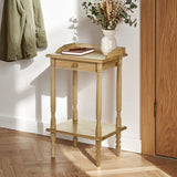 Rectangular side table made from tropical hevea wood, featuring a smooth top surface with a decorative edge, a lower shelf for additional storage, and four slender legs. The table is positioned against a wall with a coat hanging nearby and a vase with dried flowers on top, set on a wooden floor