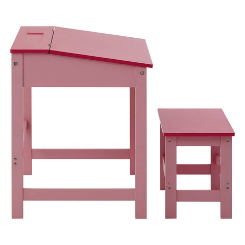 A pink children's desk with a slanted top and a matching stool, both featuring a simple design and sturdy legs. The desk includes a small storage compartment on the top surface