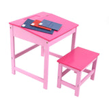 A pink children's desk with a matching stool, featuring a flat tabletop and sturdy legs. On the desk, there are two colorful notebooks and a set of colored pencils. The overall design is simple and playful, suitable for a child's room or play area