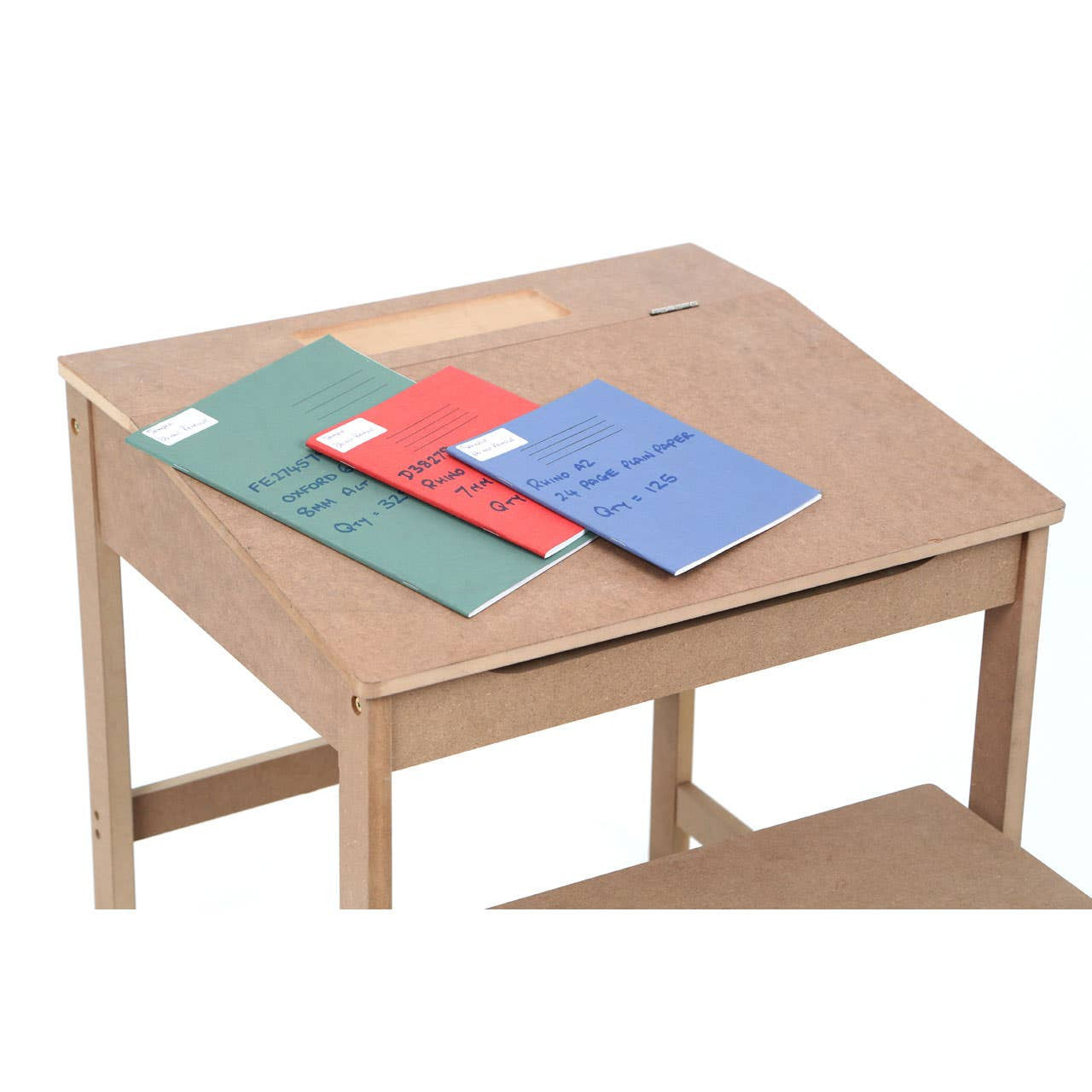Natural wood desk with a slanted top, featuring three colorful notebooks in red, green, and blue placed on the surface. The desk has a lower shelf for additional storage. A matching stool is positioned nearby, complementing the desk's design
