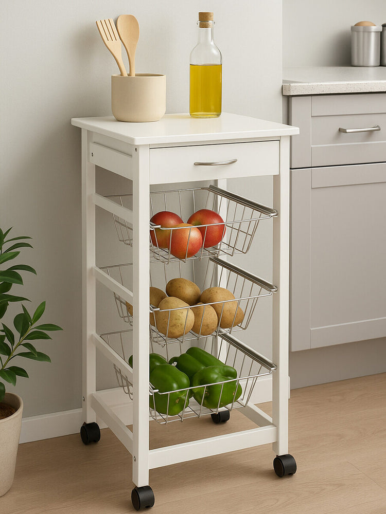 White veneer finish kitchen trolley with a flat top, featuring a bottle of olive oil and wooden utensils. The trolley has three open shelves displaying apples, pears, and limes, and is mounted on wheels for easy mobility. The background includes a light-colored kitchen setting with cabinets