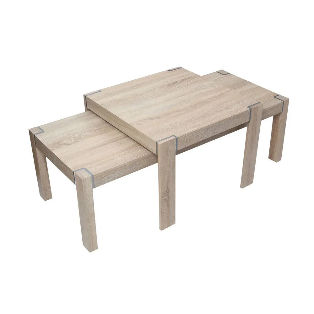 Set of two nesting coffee tables in light wood finish with metal corner accents