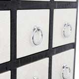 Rectangular cabinet featuring nine drawers with a crocodile leather effect finish, accented by chrome ring handles. The cabinet has a sleek design with a contrasting black border around the drawers