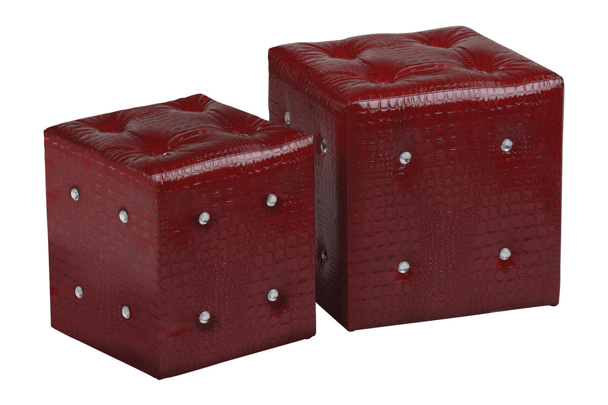 Two red stools with a crocodile leather effect, featuring a glossy finish and decorative silver studs on the sides. The stools are cube-shaped, with one being slightly larger than the other