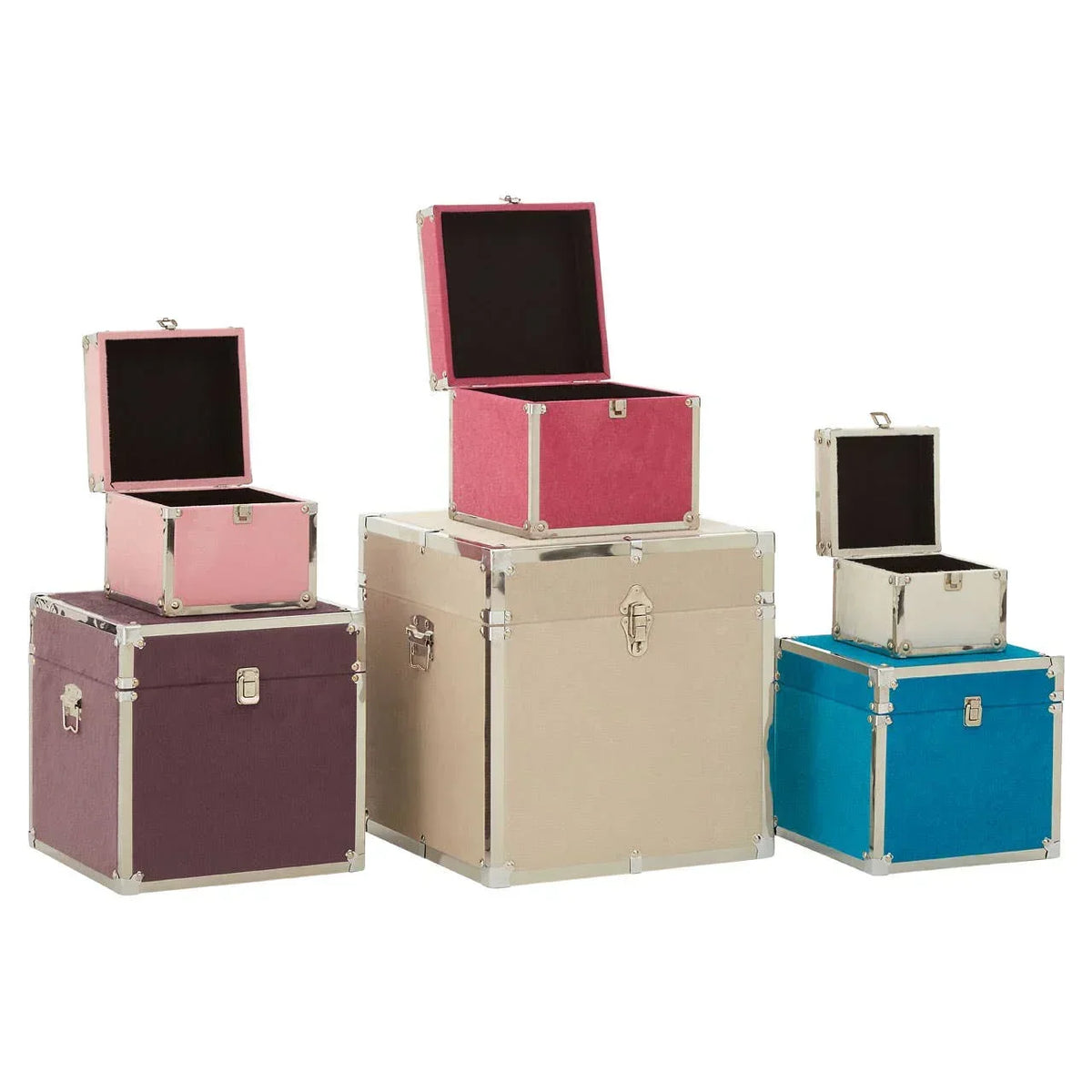 Set of colorful storage trunks in pink, beige, blue, and purple with open and closed lids