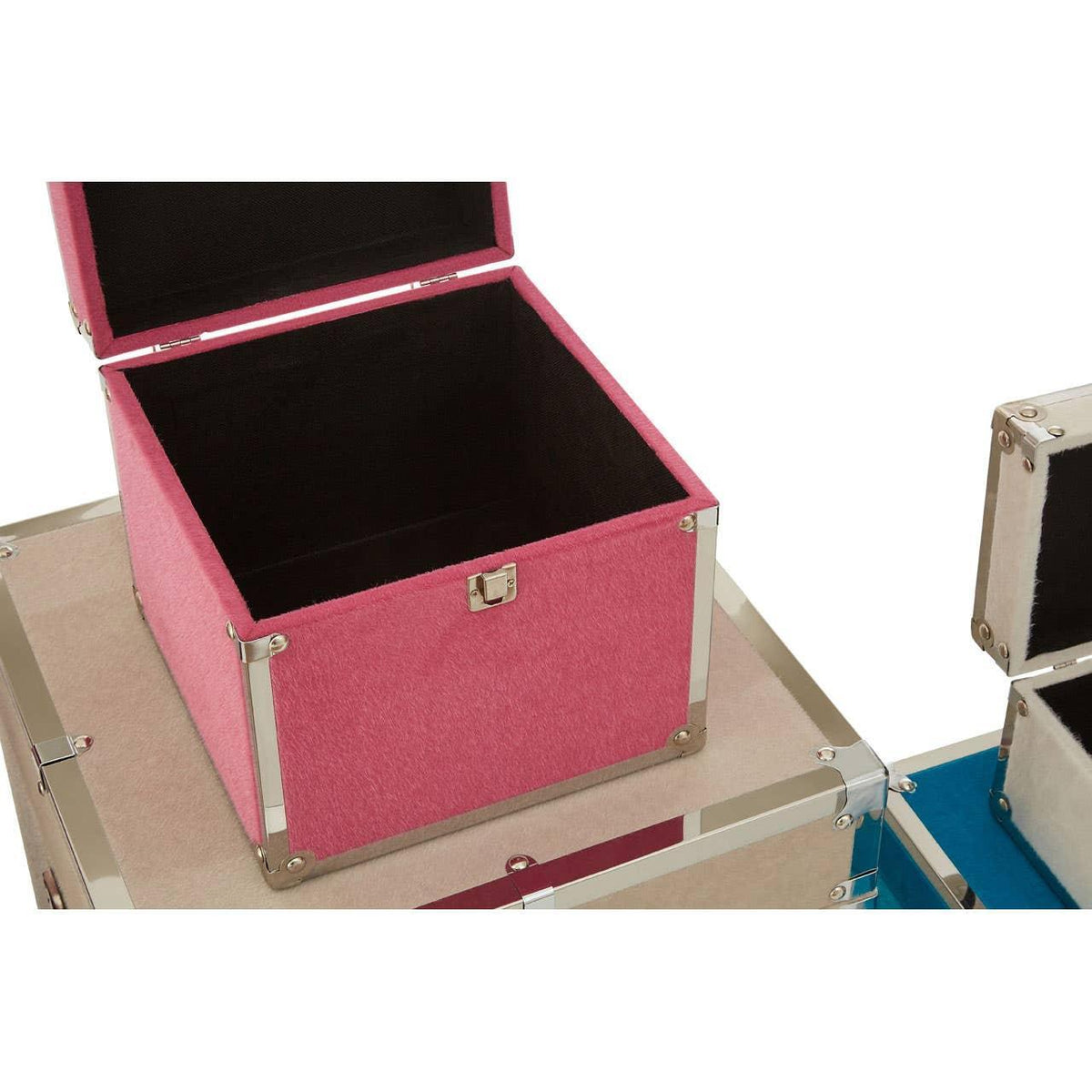 Pink storage trunk with open lid, metal corners, and black interior, stacked on beige trunk