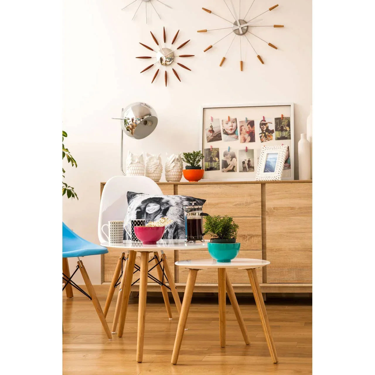 Scandinavian style nesting tables with wood legs and white tops in modern living room