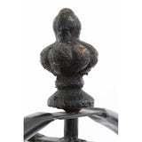 The top of the New York Loft Black 3 Tier Shelf Unit features an ornate finial with a textured surface, showcasing a dark black finish. The shelf unit has a sturdy metal frame with three open tiers, designed for displaying items or storage. The overall design combines elegance with industrial style, suitable for various home decor themes