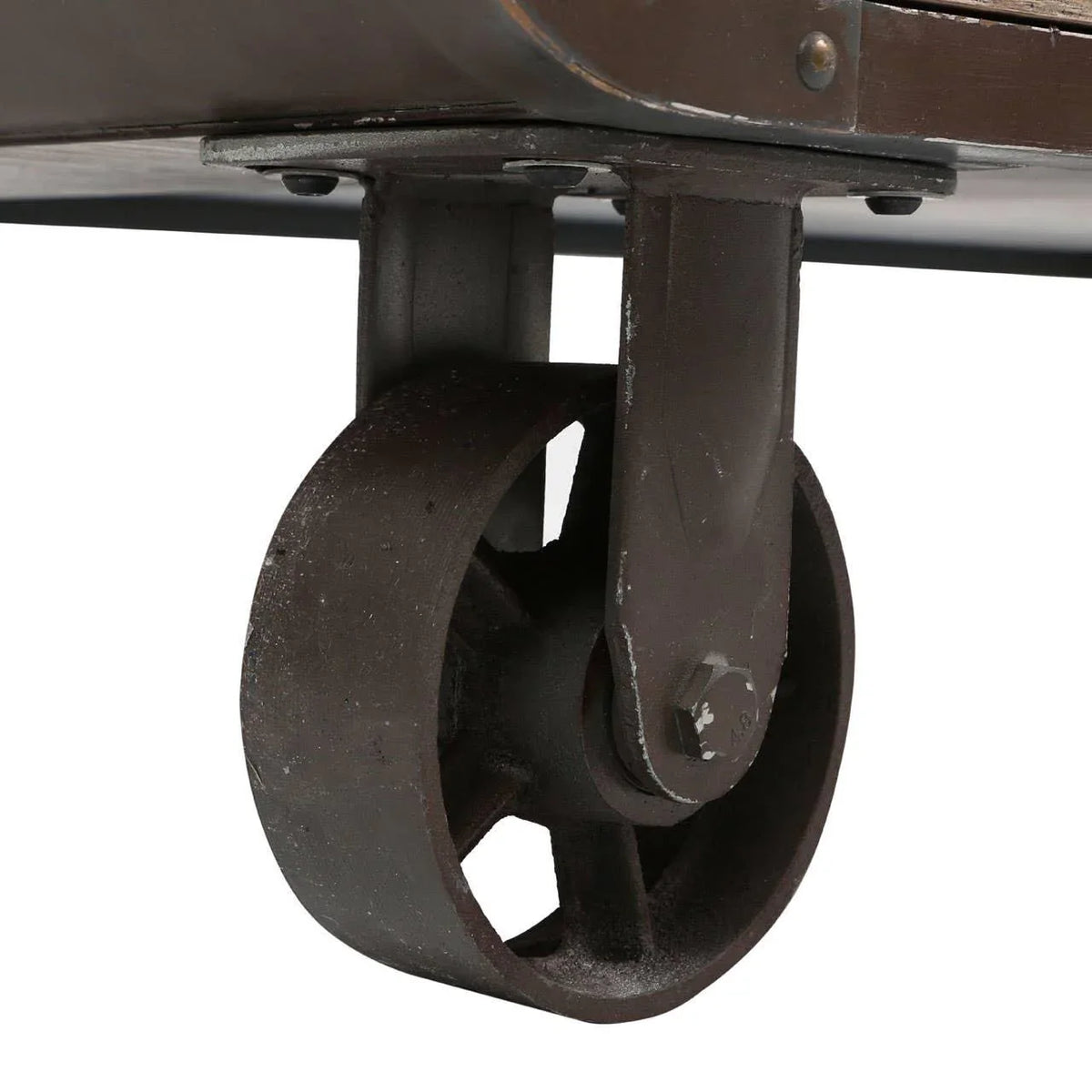Industrial coffee table metal wheel with rustic finish, close-up of cast iron caster