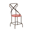 A red metal seat chair with a cross-back design and a circular seat, featuring a sturdy frame with curved legs and a minimalist aesthetic