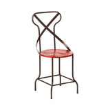 A red metal seat chair with a cross-back design and a circular seat, featuring a sturdy frame with curved legs and a minimalist aesthetic