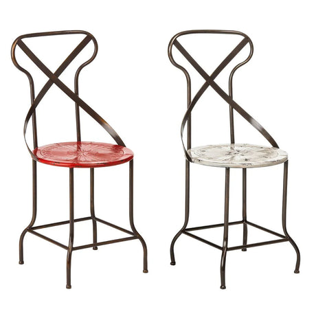 Pair of metal dining chairs with decorative red and white seats and black curved frames