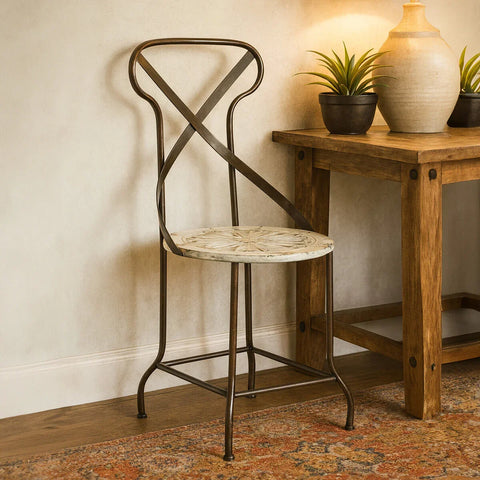 Metal dining chair with patterned wooden seat next to rustic wooden console table